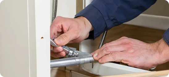 Plumber repairing a pipe