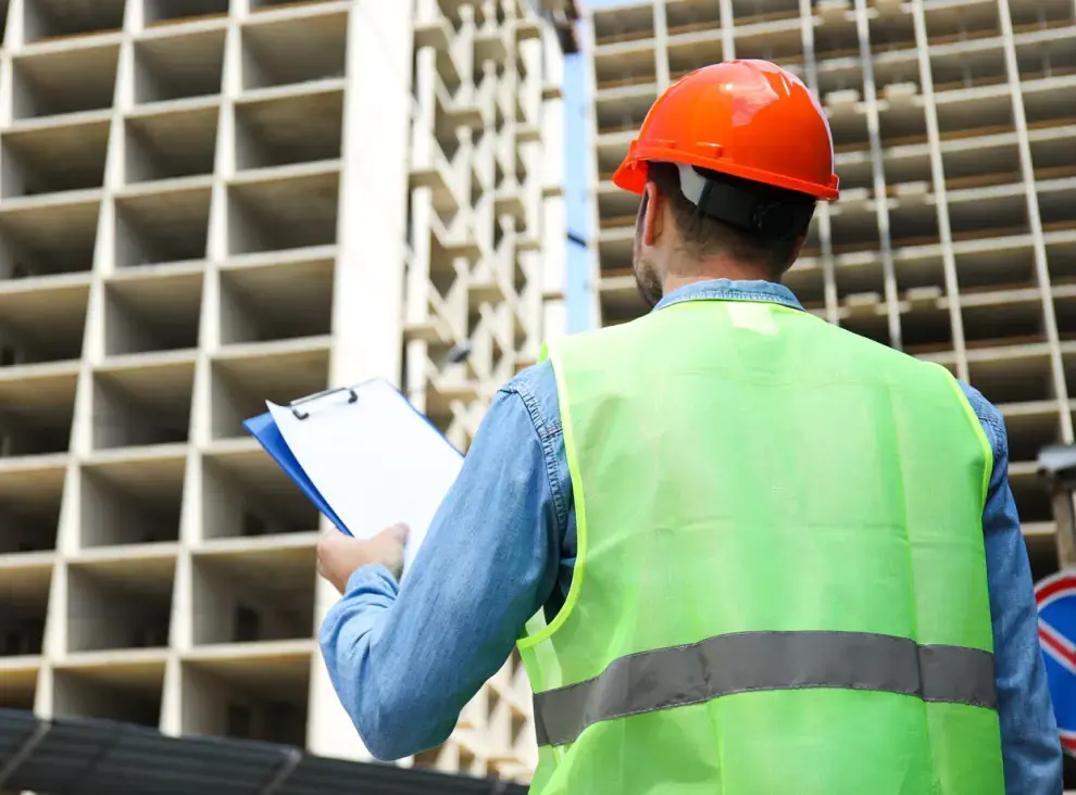 building surveyor looking at building in london